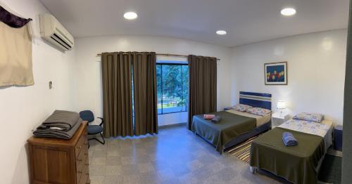 a bedroom with two beds and a window at Departamento Completo, 3 habitaciones. Excelente ubicación in Asunción