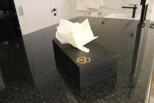 a piece of paper sitting on top of a table at WeEnjoy Hotels Grand Prix Aeropuerto CDMX in Mexico City