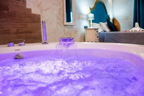 a purple bath tub filled with purple liquid at Sierra Palomera 2 in Camañas