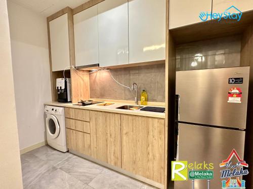 Η κουζίνα ή μικρή κουζίνα στο Imperio Residence By Heystay Management