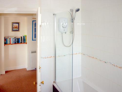 a shower with a glass door in a bathroom at Bishop Rock - Grl in Trevilley