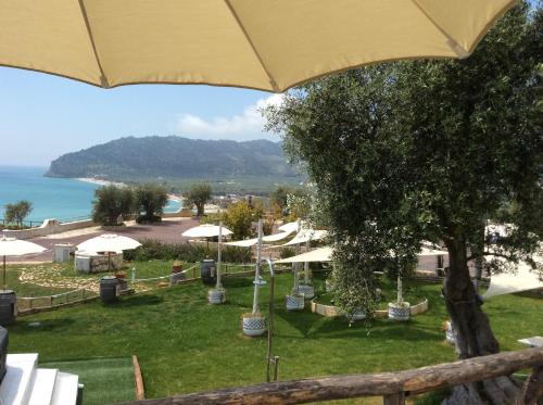 a view of a resort with an umbrella at Holiday Lodge al Porto in Mattinata