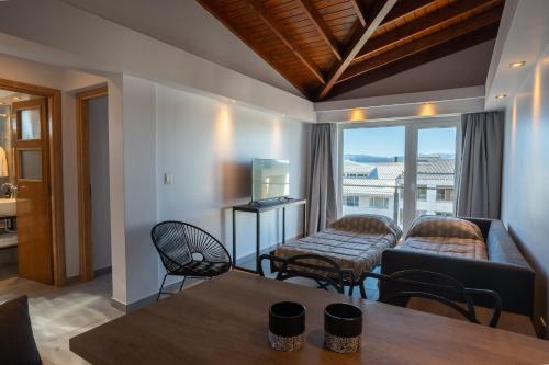 a living room with a couch and a table at Portales de la Patagonia Apartments in San Carlos de Bariloche