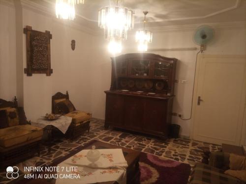 a living room with a couch and a large organ at Decapolis in Irbid