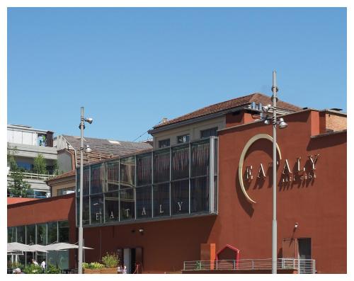 a building with aania sign on the side of it at Lingotto Side House - Affitti Brevi in Turin