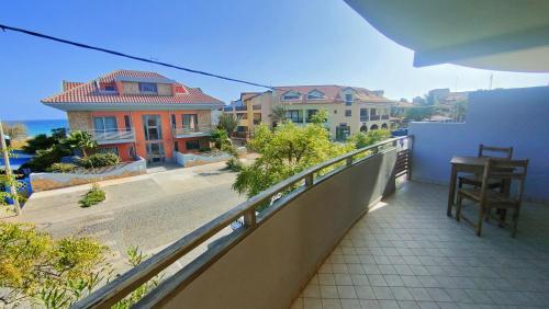 a balcony with a view of a street and buildings at Albis Harena - Meridiana Private Apartment Ocean View in Santa Maria