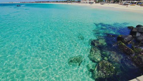 an aerial view of a beach with clear water at Albis Harena - Meridiana Private Apartment Ocean View in Santa Maria