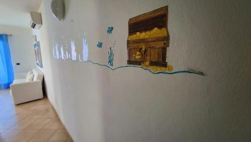 a painting of a door on a wall at Albis Harena - Meridiana Private Apartment Ocean View in Santa Maria
