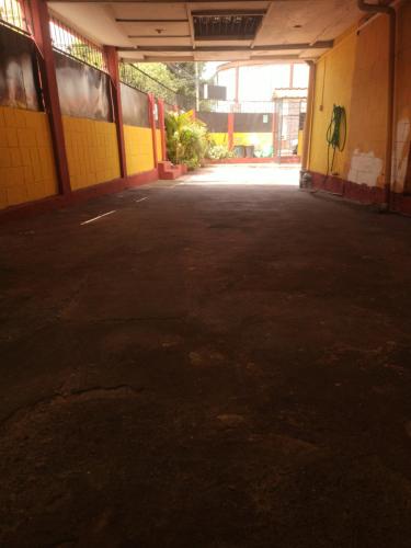 an empty parking lot in an empty building at Hostal Globo in Quito