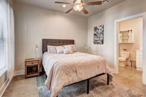 a bedroom with a bed and a ceiling fan at Youngsville Sports Complex NEW Townhome in Youngsville