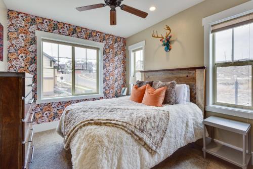 a bedroom with a bed with orange pillows at Park City Vacation Rental with Private Hot Tub! in Keetley Junction