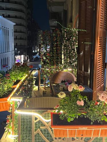 a view of a balcony with flowers and plants at Paris east in Cairo