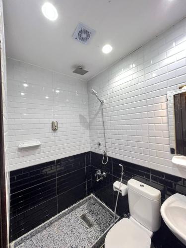 a bathroom with a shower and a toilet and a sink at Paris east in Cairo
