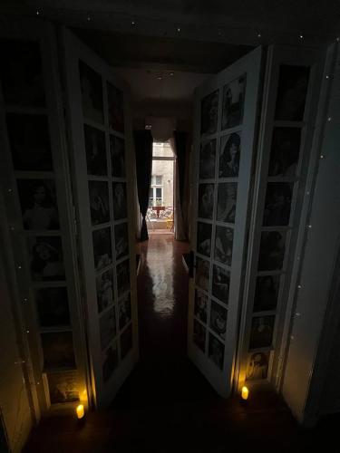 a hallway with pictures on the walls of a room at Paris east in Cairo