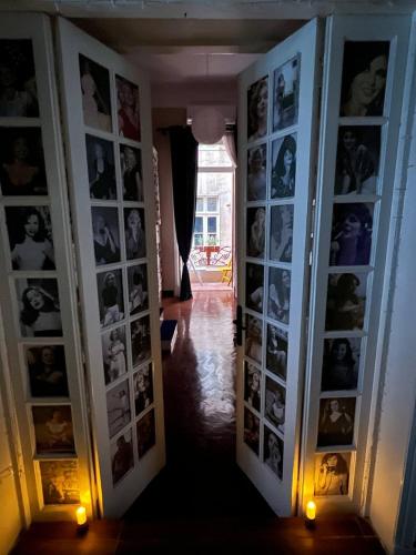 a hallway with a bunch of photos on the wall at Paris east in Cairo