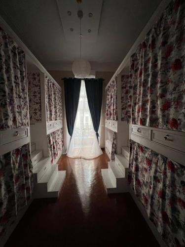 a room with a window with curtains and a window sill at Paris east in Cairo