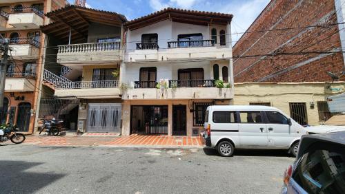 a white van parked in front of a building at apartamento en ENVIGADO in Envigado