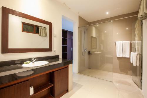 a bathroom with a sink and a shower at Sanur Beach Villa - 3BR Private Pool in Sanur