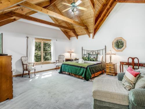 a bedroom with a bed and a couch at Amazing River Retreat in Sevierville