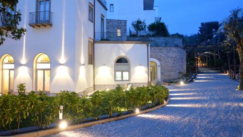 a building with lights on the side of it at Il Palmento Relais in Piano di Sorrento