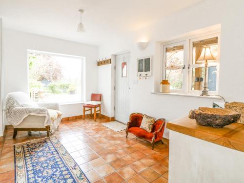a living room with a table and chairs at Highfield House in Leek