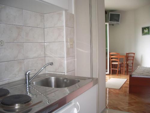 a kitchen with a sink and a counter top at Josip II - 150 m from beach in Baška Voda