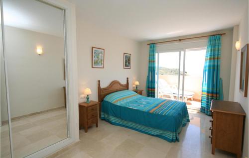 a bedroom with a bed and a large mirror at Bella Vista Hills in Mijas Costa