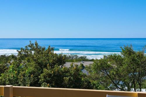 a view of the ocean from the balcony of a beach at Carlaminda Peregian Beach in Peregian Beach