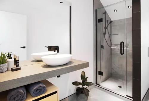 a bathroom with a sink and a shower at Cardrona Vista Apartment in Cardrona