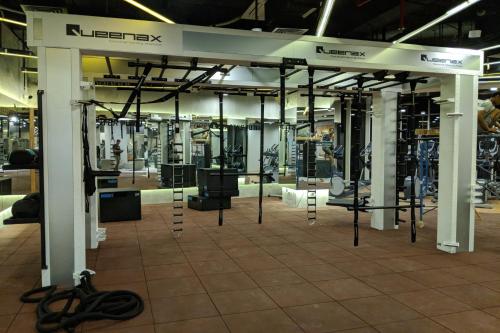 a gym with a rack of equipment in a building at Pentacity Hotel Balikpapan in Balikpapan