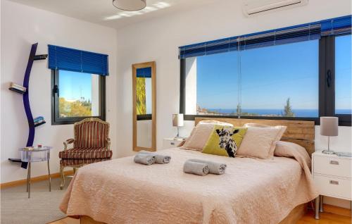 a bedroom with a large bed with two stuffed animals on it at Villa Holivista in Benalmádena