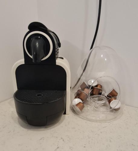 a black and white blender sitting on a counter at צימר נרקיס in Eilat