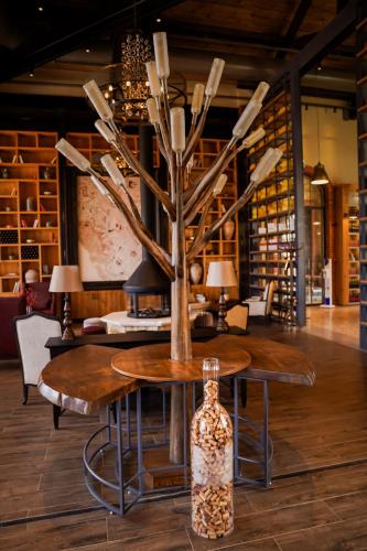 a table with a vase on top of it at Bengodi Boutique Hotel in Eceabat