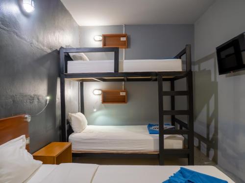 Postel nebo postele na pokoji v ubytování Leisure Hostel