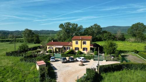 an aerial view of a house with cars parked in a driveway at Life B&B in Sutri