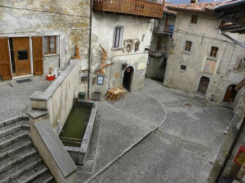 an aerial view of a courtyard in an old building at B&B Piccolo Tibet in Lavenone