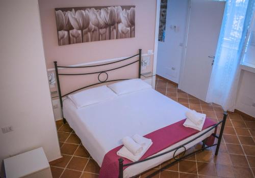 Postel nebo postele na pokoji v ubytování B&B Quattro Lune