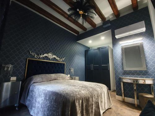 En eller flere senge i et værelse på Daniela's Venetian Style