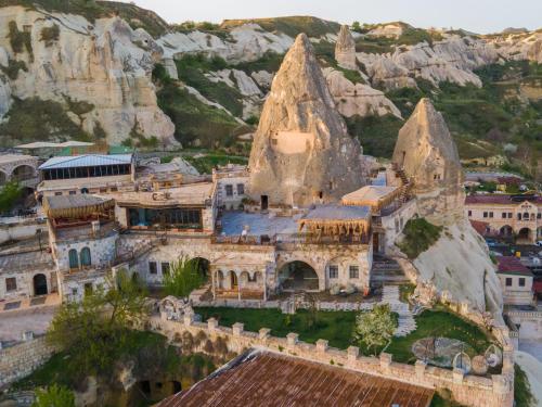 an aerial view of a house on a mountain at Panoramic Cave Hotel in Goreme