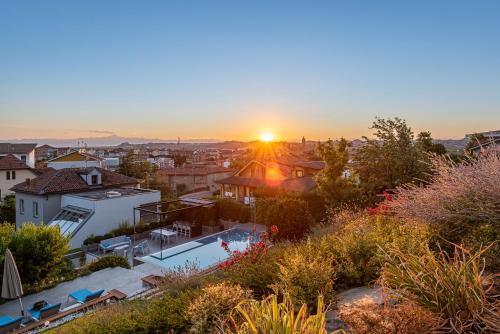 a view of the sunset from a house at Villa Anna, Luxury and private pool in Alba
