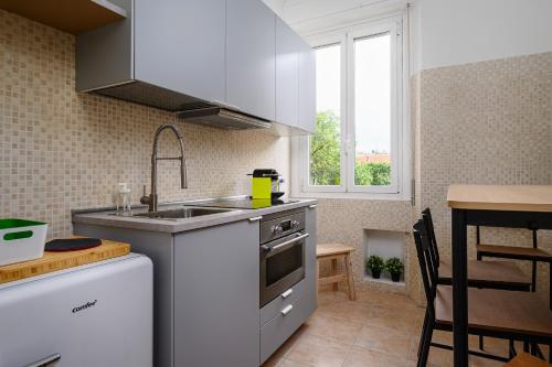 Kuchyň nebo kuchyňský kout v ubytování Ennio 8 - Bilocale Cool