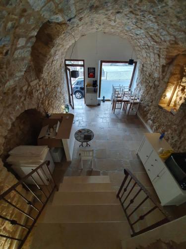 an overhead view of a stone building with stairs and tables at Il Daviduccio ibla in Ragusa