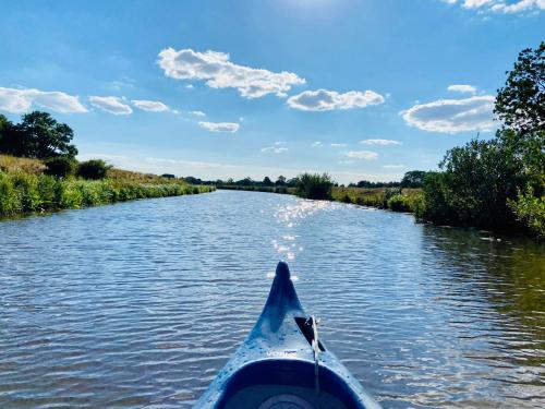 a view from the back of a canoe on a river at Stilvolles Apartment mit Saunazugang in Burg