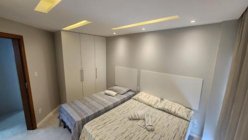 Postel nebo postele na pokoji v ubytování FLAT Jardim de Alah - Frente Praia