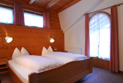 Postel nebo postele na pokoji v ubytování Zillertal Apartments