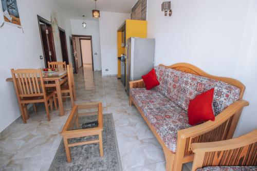 a living room with a couch and a table at Swiss Royal DAHAB in Dahab