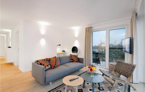 a living room with a couch and a table at Penthouse Deluxe in Lembruch