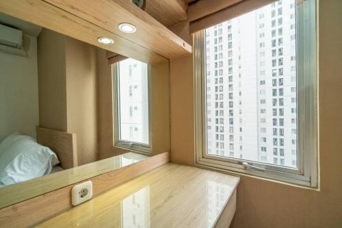 Кровать или кровати в номере Premium 2BR @ Bassura City East Jakarta