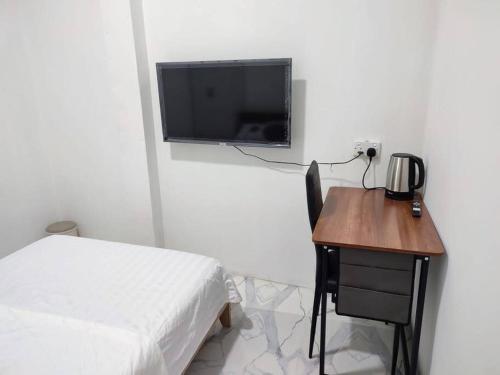 TV a/nebo společenská místnost v ubytování Kanbo Stay