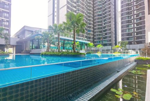 a swimming pool in a city with tall buildings at rumaKL at Majestic Maxim in Kuala Lumpur